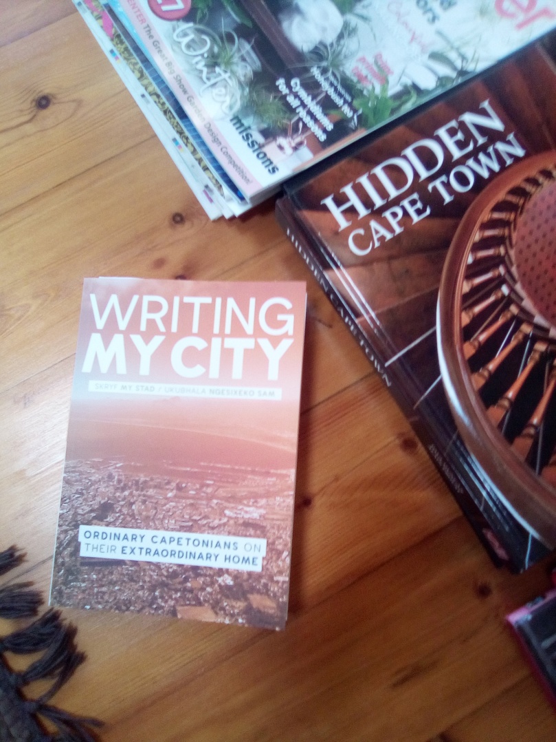 writing my city book on the coffee table