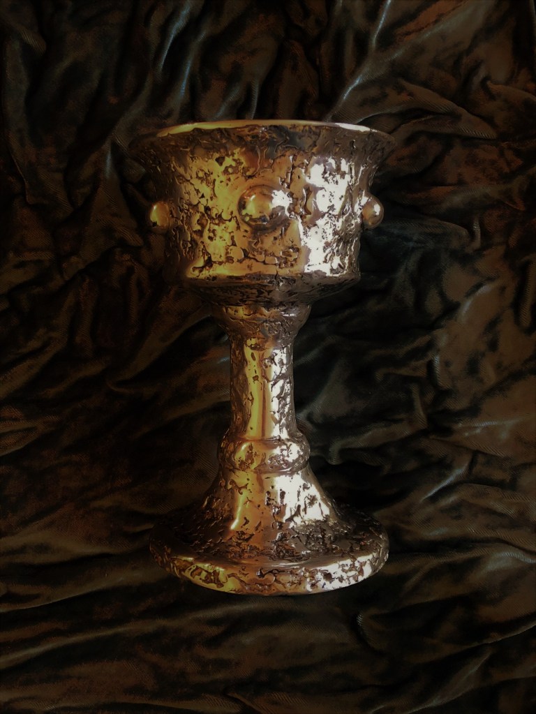 A photo of an old silver chalice