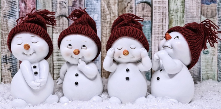 The image shows four tiny snow men like figures in different poses. All looking very cute!